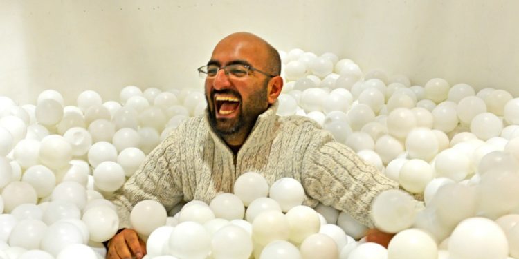 Co-founder Shamash Alidina playing in white ball pit